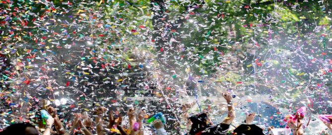 throwing graduation caps with confetti