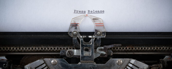typewriter and the words "press release"
