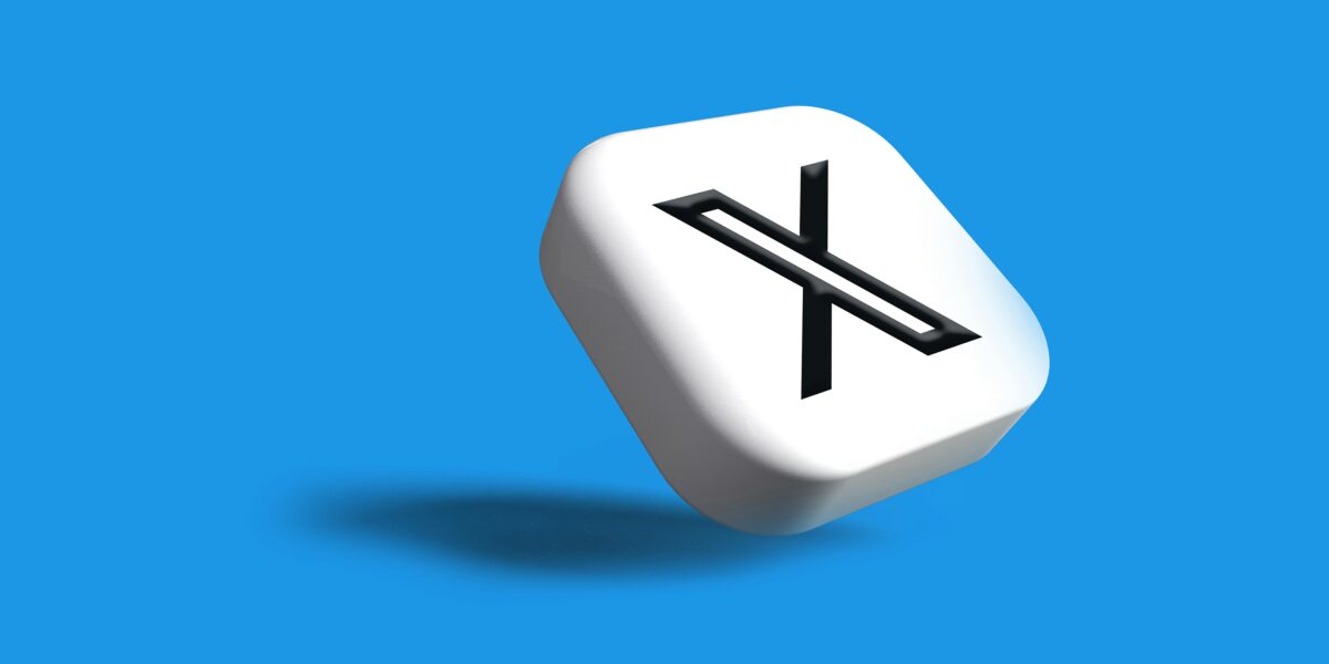 the X logo on a tile against a blue background