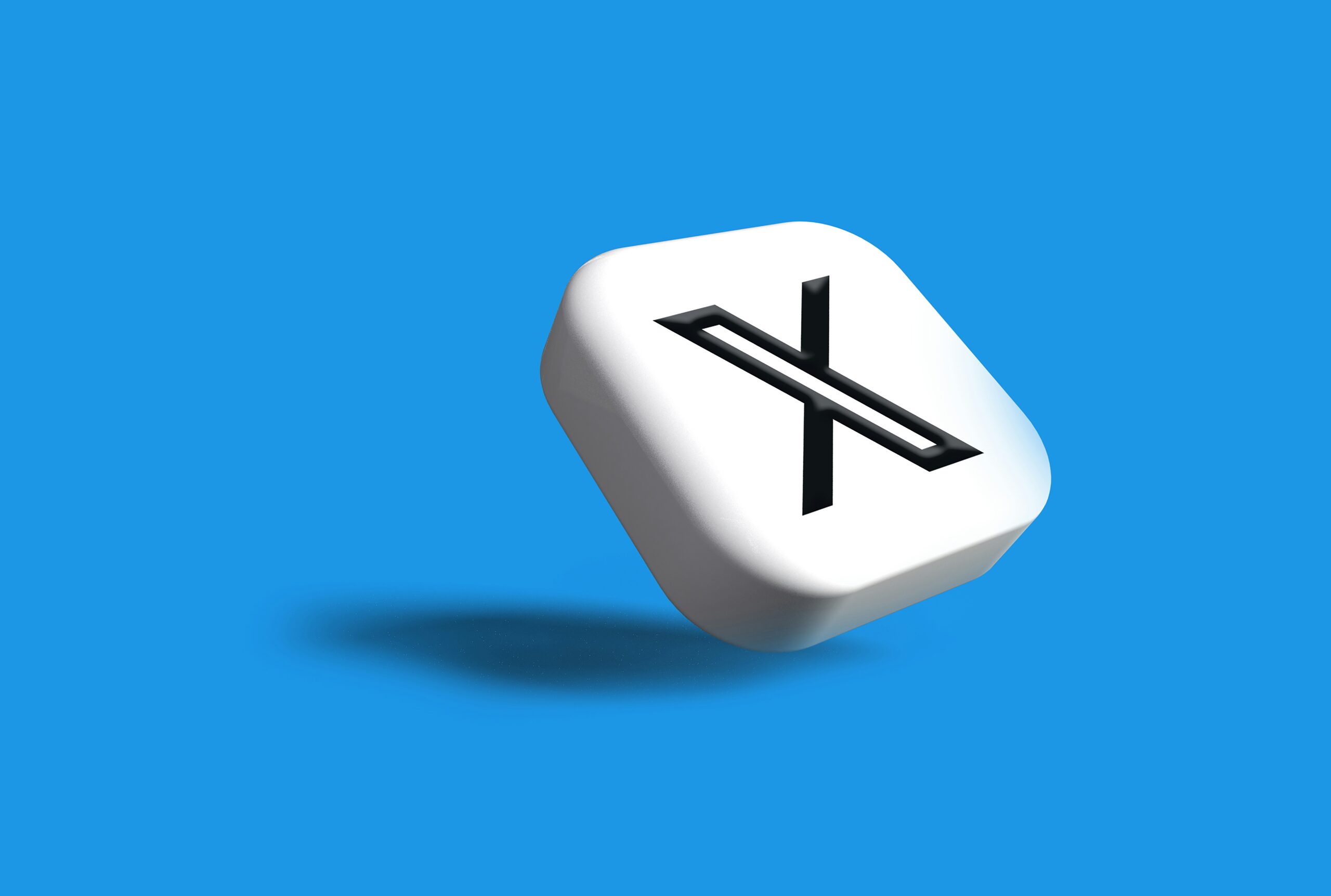 the X logo on a tile against a blue background