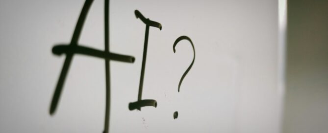 the words, "AI?" written on a whiteboard