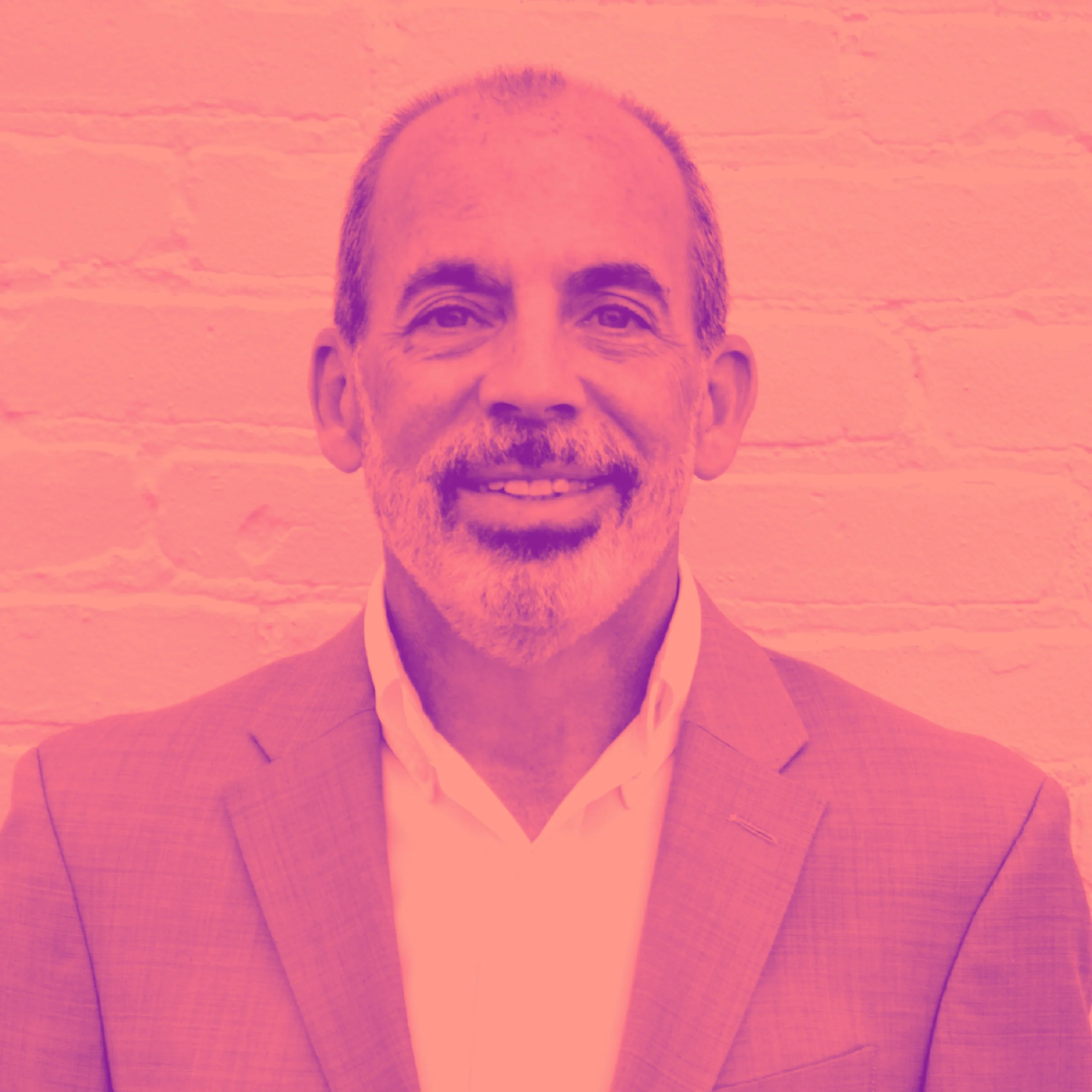 Jim_S_Duo Professional headshot of man with goatee in blazer with pink-magenta duotone treatment