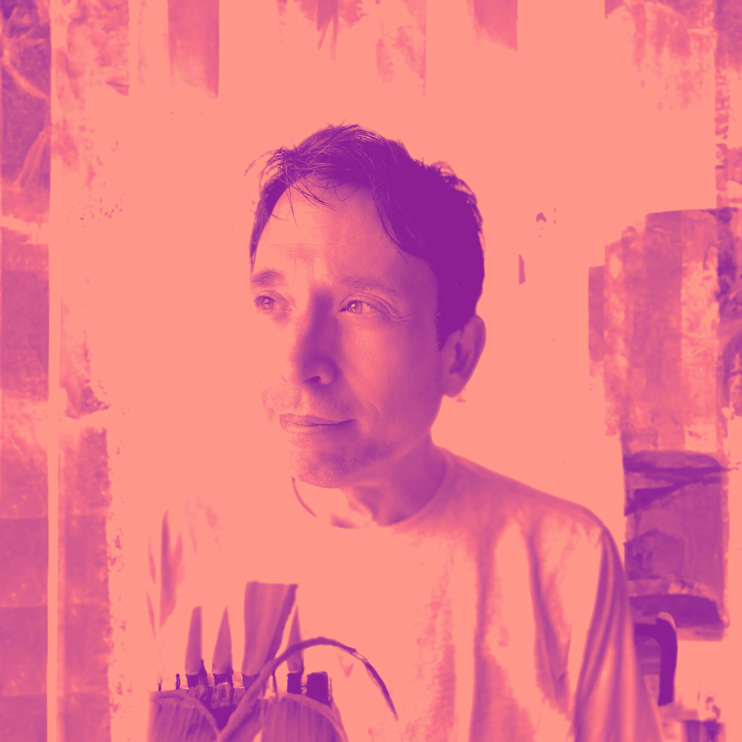 Tony_K_Duo Professional headshot of man in graphic tee with bold pink-magenta duotone treatment
